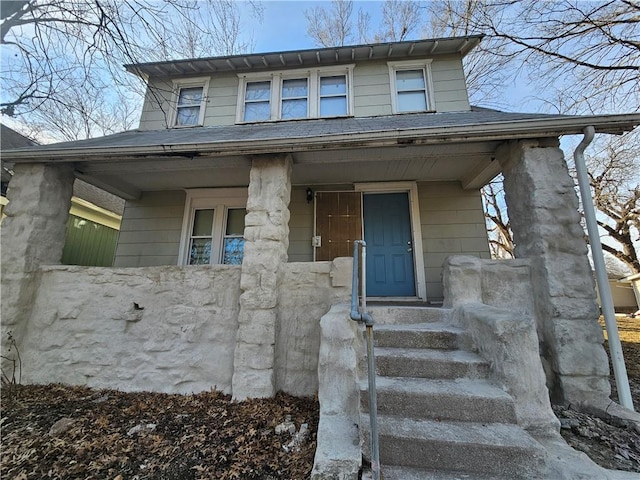 318 Belmont Blvd, Kansas City, MO 64123 - view of front of house featuring covered porch