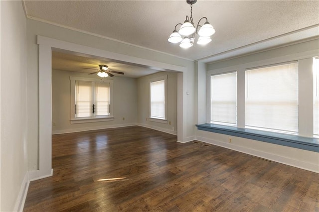 unfurnished room featuring dark wood-type flooring, ceiling fan with notable chandelier, and a textured ceiling