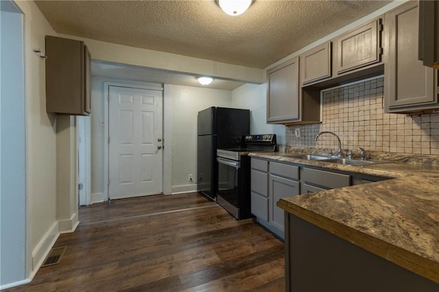 kitchen with gray cabinets, tasteful backsplash, sink, stainless steel range with electric cooktop, and dark hardwood / wood-style flooring