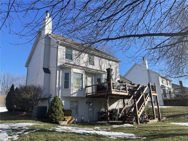 back of property featuring central AC unit, a chimney, stairway, and a deck