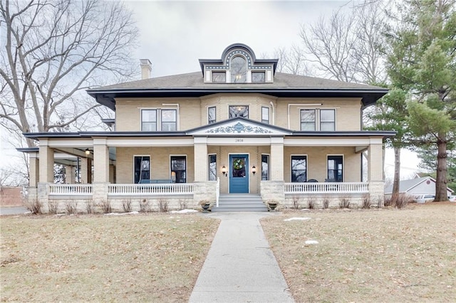 view of front of property featuring a porch and a chimney