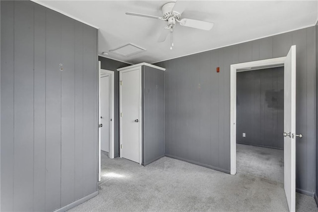 unfurnished bedroom with light carpet and ceiling fan