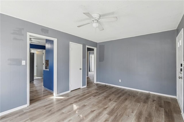 unfurnished bedroom with hardwood / wood-style flooring and ceiling fan