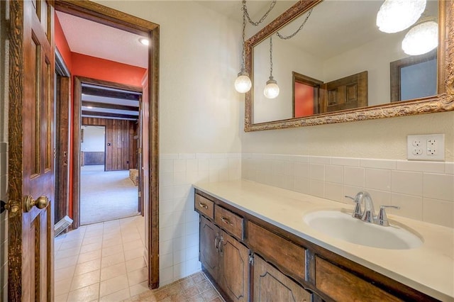 bathroom featuring tile patterned floors, vanity, and tile walls