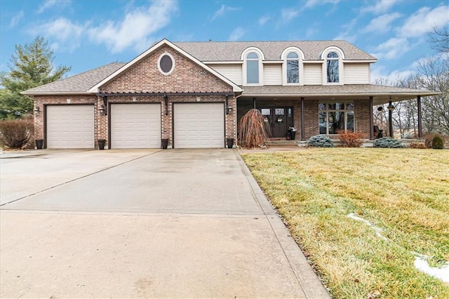 view of front of property with a garage and a front yard