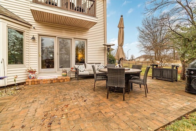 view of patio / terrace with an outdoor living space and a balcony