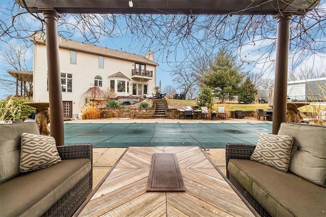 view of swimming pool with a wooden deck and an outdoor hangout area