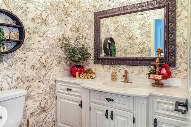 bathroom with vanity and toilet