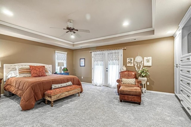 bedroom featuring carpet flooring, ornamental molding, access to exterior, and a raised ceiling