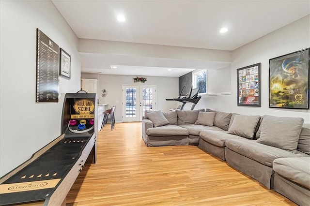 living room with light hardwood / wood-style floors and french doors