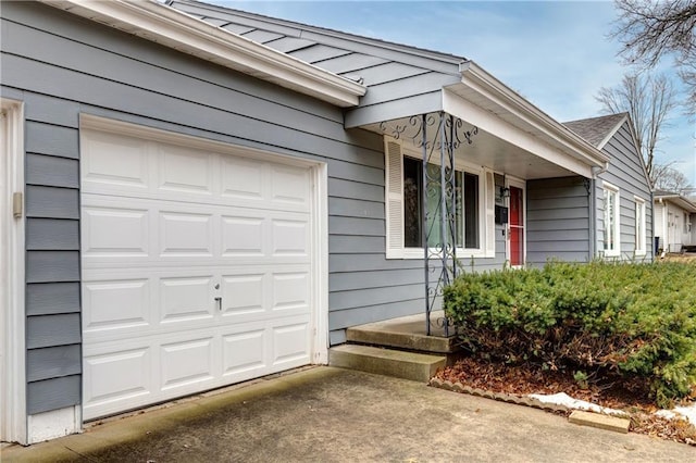 view of front of property featuring a garage and concrete driveway