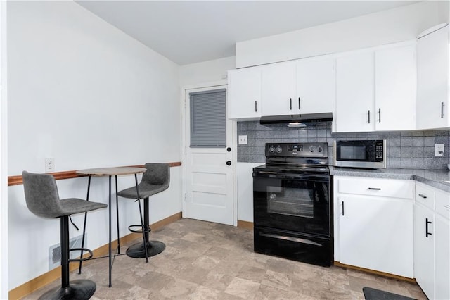 kitchen featuring electric range, stainless steel microwave, under cabinet range hood, white cabinetry, and backsplash