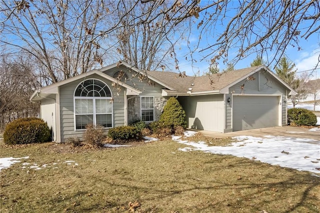 single story home with a garage and a lawn