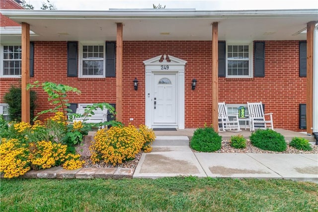 doorway to property featuring covered porch