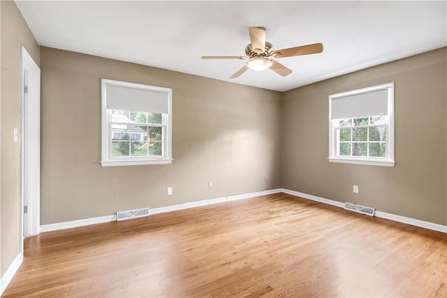 spare room with ceiling fan and light hardwood / wood-style flooring