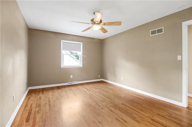 spare room with light hardwood / wood-style flooring and ceiling fan