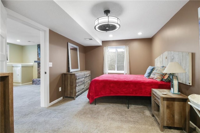 bedroom featuring light colored carpet