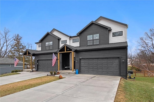 view of front facade with a garage and a front yard