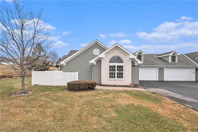 view of front of home featuring a garage and a front yard