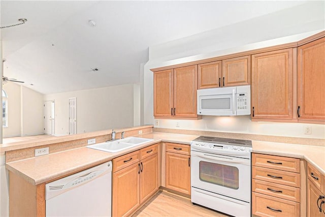 kitchen with ceiling fan, white appliances, kitchen peninsula, and sink