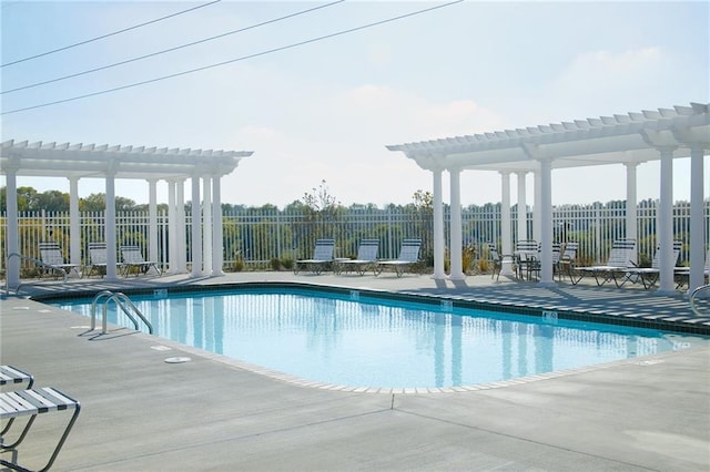 view of pool with a pergola and a patio