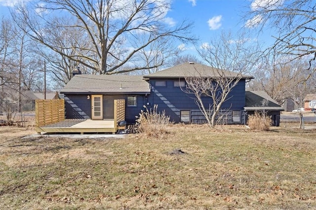 7901 Hedges Ave, Raytown, MO 64138 - rear view of house with a yard and a wooden deck