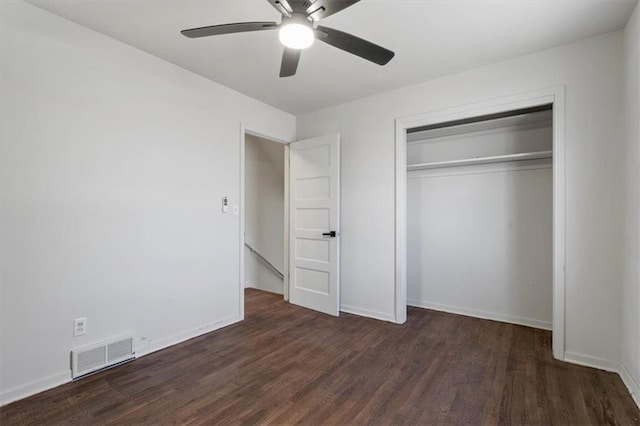7901 Hedges Ave, Raytown, MO 64138 - unfurnished bedroom with wood finished floors, visible vents, a closet, and baseboards