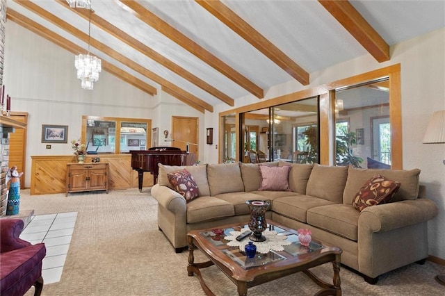 living room featuring a notable chandelier, beam ceiling, light colored carpet, and high vaulted ceiling