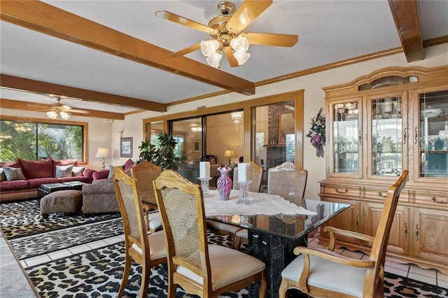 tiled dining room featuring beamed ceiling and ceiling fan