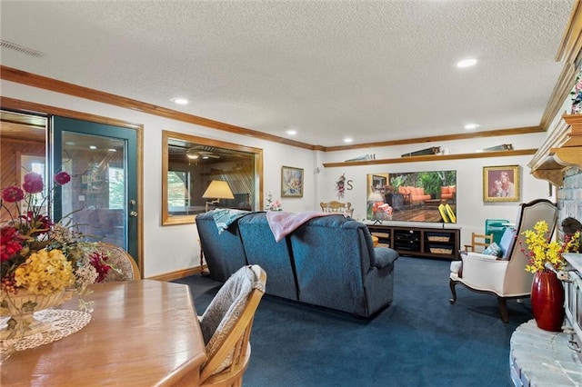 carpeted living room featuring ornamental molding and a textured ceiling