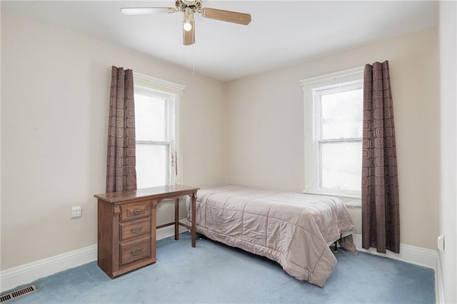 bedroom featuring carpet, visible vents, and baseboards