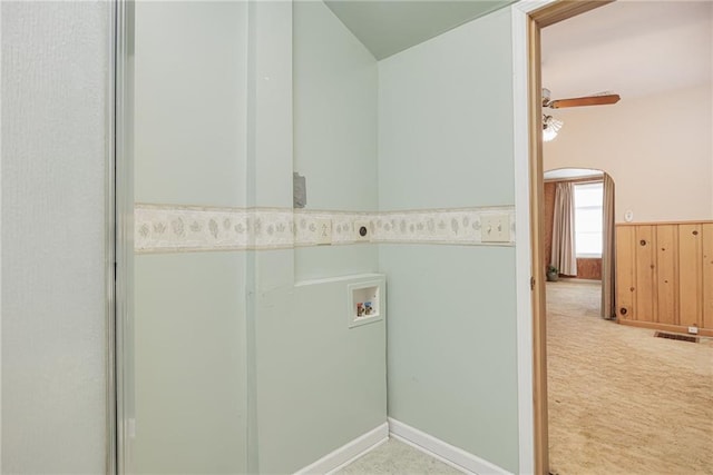 laundry area with laundry area, wooden walls, a wainscoted wall, hookup for a washing machine, and carpet floors