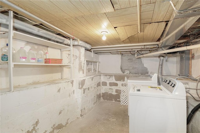 unfinished basement with washer and clothes dryer