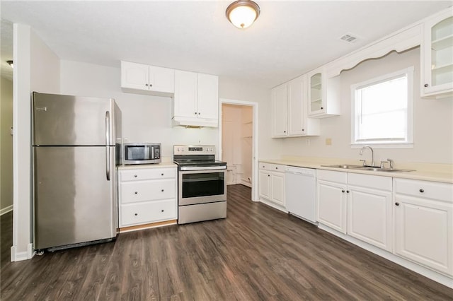 kitchen featuring white cabinetry, appliances with stainless steel finishes, sink, and dark hardwood / wood-style flooring