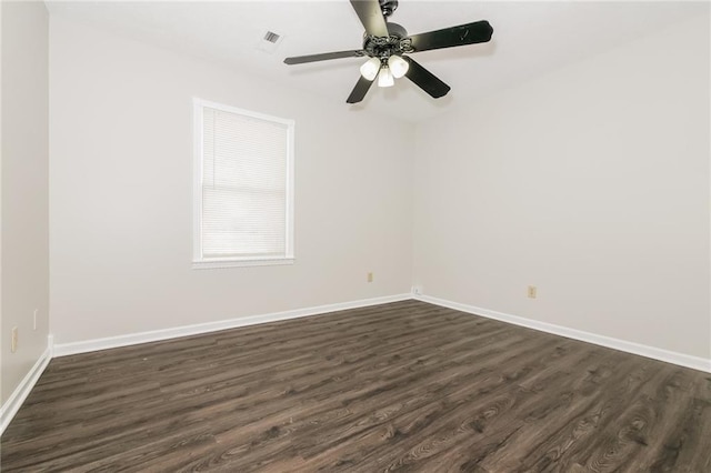 unfurnished room featuring dark hardwood / wood-style flooring and ceiling fan