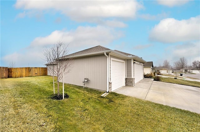 view of home's exterior featuring a garage and a yard