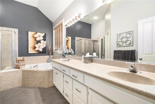 bathroom featuring lofted ceiling, tile patterned floors, plus walk in shower, and vanity