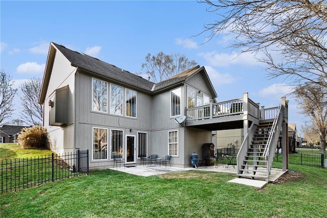 back of house featuring a patio, a deck, and a lawn