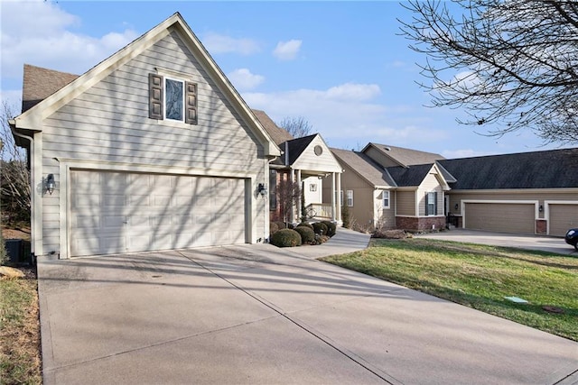 view of property featuring a garage and a front yard