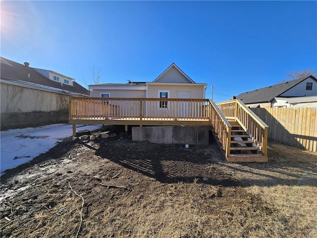 rear view of property with a wooden deck