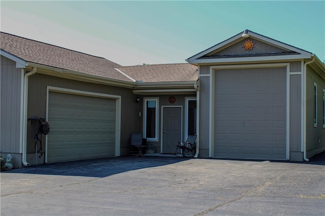 ranch-style home featuring a garage