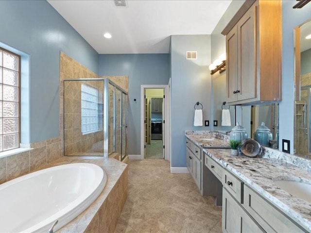 full bath featuring visible vents, a stall shower, double vanity, a bath, and a spacious closet