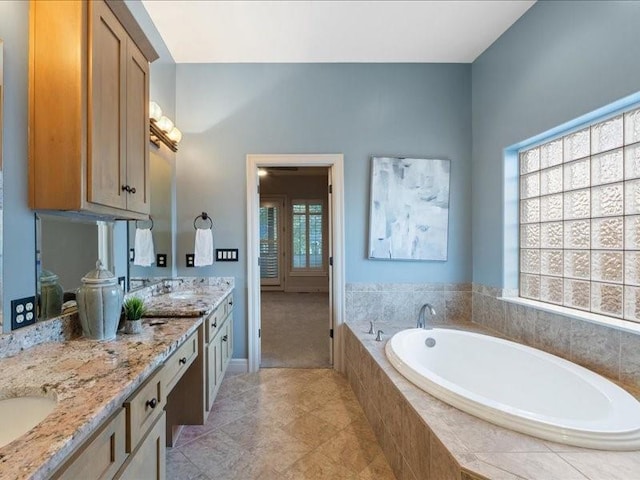 full bathroom with double vanity and a garden tub