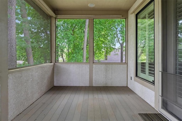 unfurnished sunroom featuring wood-type flooring