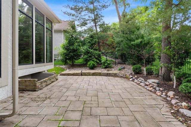 view of patio featuring fence