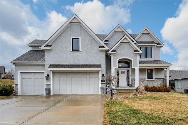 view of front facade featuring a garage and a front lawn