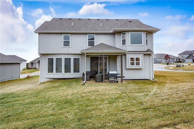 rear view of property with a patio area and a lawn