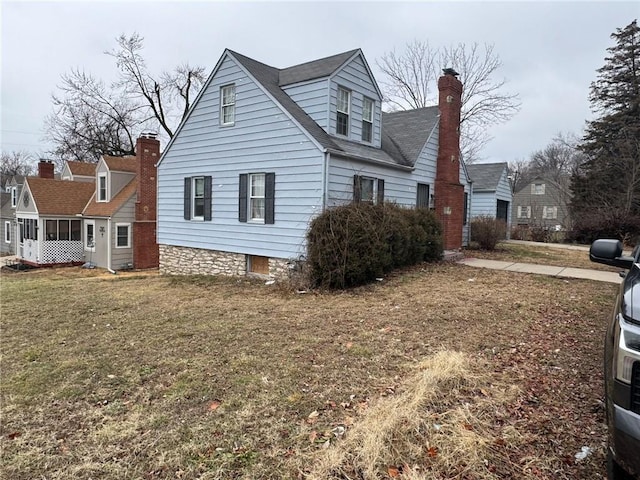 view of side of property with a yard