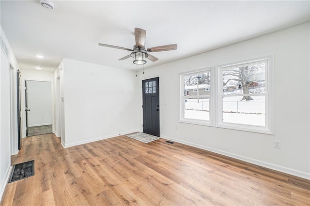 foyer with light wood-type flooring and ceiling fan