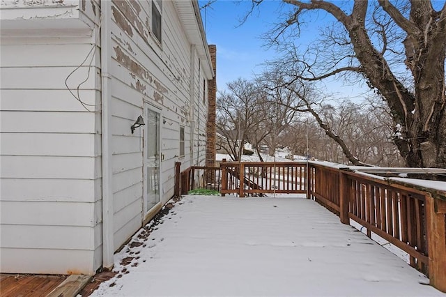 view of snow covered deck